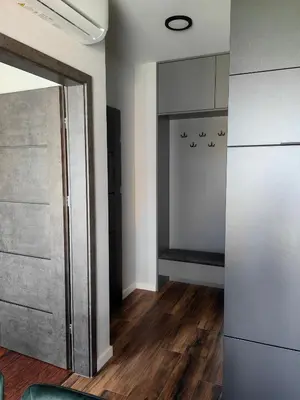 a room with a closet and a door with a mirror at Apartamenty Zator Jaśminowa in Zator
