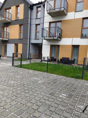 a building with balconies on the side of it at Apartamenty Zator Jaśminowa in Zator