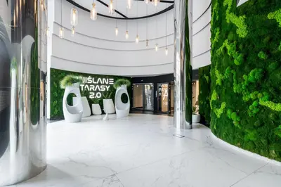 a hallway in a building with a usline pharmacy sign at Wiślane Tarasy 2 0 Chic Studio by BookingHost in Kraków