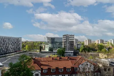 a view of a city with buildings and roofs at Wiślane Tarasy 2 0 Chic Studio by BookingHost in Kraków