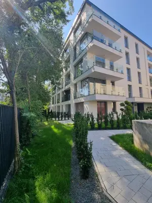 an apartment building with a walkway in front of it at Metropolis Old Town Apartments in Kraków