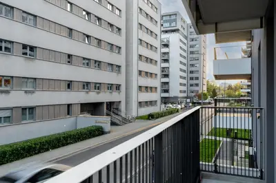 an apartment balcony with a view of a building at Bronowice Comfy Studio by BookingHost in Kraków