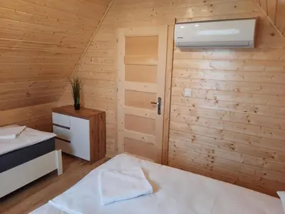 a small room with a bed and a window at Energy4YOU Zator in Zator