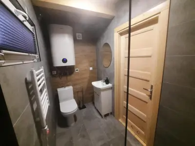 a small bathroom with a toilet and a sink at Energy4YOU Zator in Zator