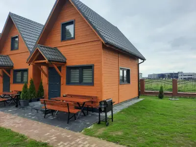 a house with a picnic table in front of it at Energy4YOU Zator in Zator