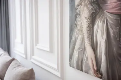 a woman in a wedding dress leaning against a window at Native Apartments Starowiślna 43 in Kraków