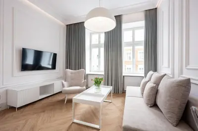 a living room with a couch and a tv at Native Apartments Starowiślna 43 in Kraków