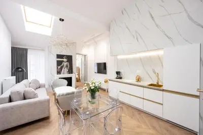 a living room with a couch and a table at Native Apartments Starowiślna 43/15 in Kraków