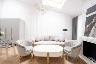 a living room with a couch and two chairs and a table at Native Apartments Starowiślna 43/15 in Kraków