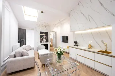 a living room with a couch and a table at Native Apartments Starowiślna 43/15 in Kraków