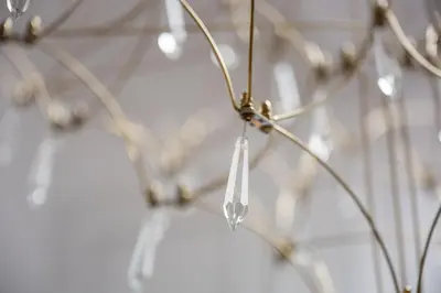 a close up of a chandelier hanging from a ceiling at Native Apartments Starowiślna 43/15 in Kraków