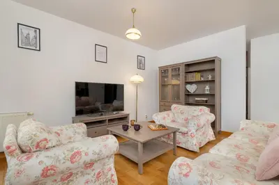 a living room with two couches and a tv at Bulwary Wiślane Kraków Apartament Ludwinowska przy Forum by Noclegi Renters in Kraków