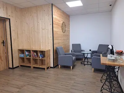 a waiting room with two chairs and a table at Pokoje Izabela - Noclegi Graboszyce - Zator in Graboszyce