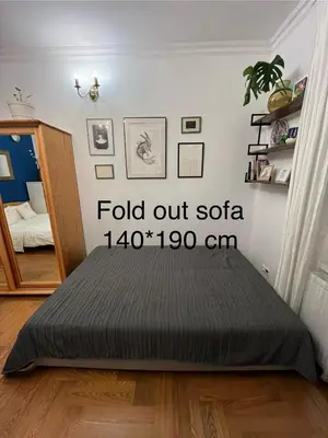 a bed in a bedroom with the words paid out soa cm at Greenthumb Praska in Kraków