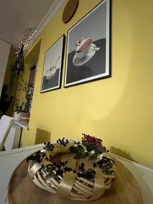 a table with a bowl on top of it in a room at Greenthumb Praska in Kraków