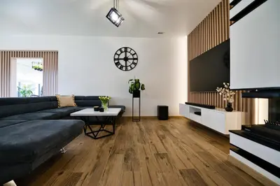 a living room with a couch and a table at Dom z jacuzzi do 10 osób Zator Willa LuxHouse in Zator