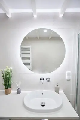 a bathroom with a white sink and a mirror at Pola Apartament Old Town - Kazimierz in Kraków