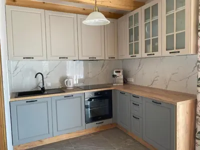a kitchen with white cabinets and a sink at Gładyszówka - Chatka w Gorcach in Ponice