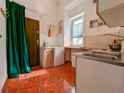 a kitchen with a sink and a dishwasher at Wiślna 4 by Homeprime in Kraków