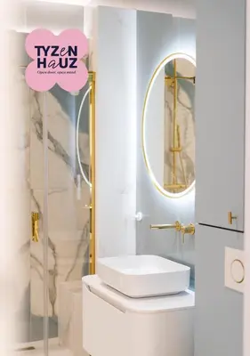 a white bathroom with a sink and a mirror at Mostowa Street by Tyzenhauz in Kraków