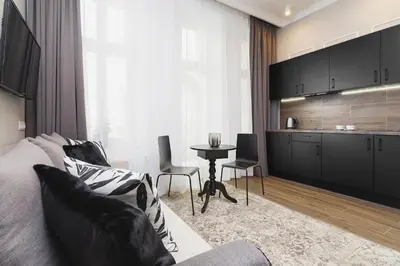 a living room with a couch and a table at Apartment with balcony - Rakowicka 6 Street in Kraków