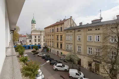 a view of a city with cars parked on a street at Augustianska - Private parking - Kazimierz District in Kraków