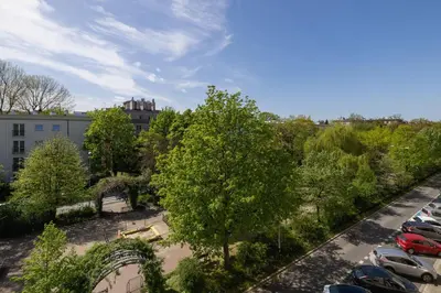 an overhead view of a parking lot with a tree at 3 bedroom apartment-Aleja Daszyńskiego- Grzegórzki in Kraków
