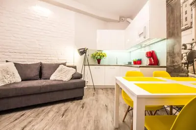 a living room with a couch and a table at 1-bedroom apartment - Kazimierz- Starowiślna 54 in Kraków