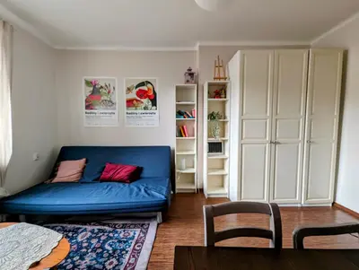 a living room with a blue couch in a room at Urzędnicza 23 by Homeprime in Kraków