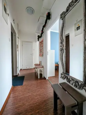 a room with a mirror on the wall and a bench at Urzędnicza 23 by Homeprime in Kraków