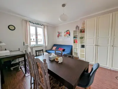 a living room with a table and a couch at Urzędnicza 23 by Homeprime in Kraków