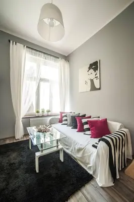 a living room with a couch and a glass table at Apartment in the centre - Old Town in Kraków