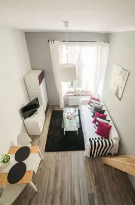 a living room with a couch and a table at Apartment in the centre - Old Town in Kraków