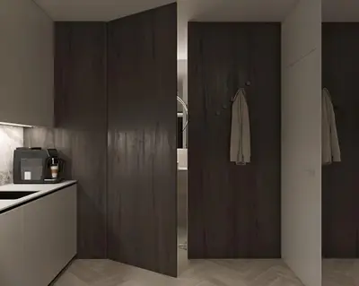 a bedroom with a large white bed and a kitchen at Prestiżowy apartament B in Kraków