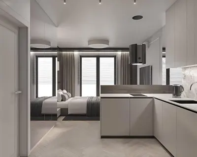 a bedroom with a large bed and a kitchen at Prestiżowy apartament B in Kraków