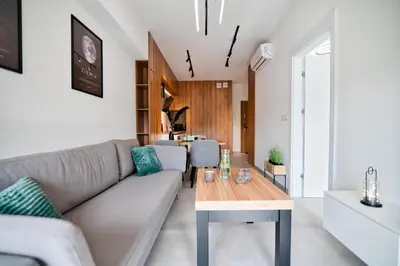 a living room with a couch and a table at Apartament Venus by Housine in Zator