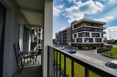 a balcony with a view of a building at Apartament Mars by Housine in Zator