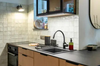 a kitchen with a sink and a counter top at Dietla 11 - Art Studio for 2 in Kraków