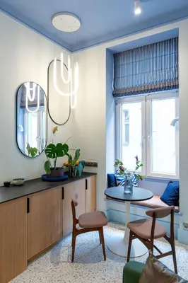 a living room with a table and a mirror at Dietla 11 - Art Studio for 2 in Kraków