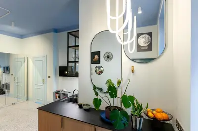a bathroom with a sink and a mirror at Dietla 11 - Art Studio for 2 in Kraków