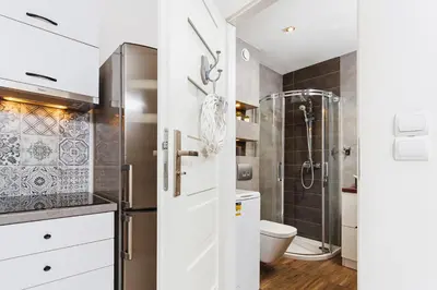 a bathroom with a toilet and a shower at Charming Studio - 54 Starowislna street in Kraków
