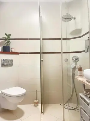 a bathroom with a shower and a toilet at Well-connected Apartment in Old Town Cracow in Kraków