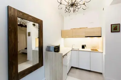 a kitchen with a mirror and a sink at Jewish Quarter - 54 Starowiślna Street in Kraków