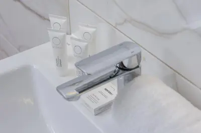a bathroom with a nintendo wii game system on a counter at Modern Apartment with Parking near Tauron Arena by Rent like home in Kraków