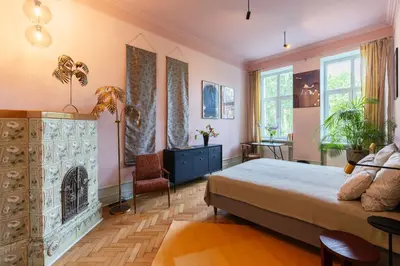 a bedroom with a bed and a fireplace at Two bedroom apartment-Dietla 11- Wawel Castle view in Kraków