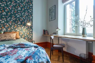 a bedroom with a bed and a desk and a window at Two bedroom apartment-Dietla 11- Wawel Castle view in Kraków