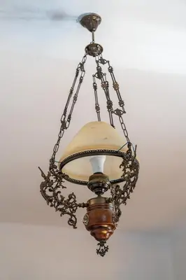 a chandelier hanging from a ceiling at Vista View Apartment in Kraków
