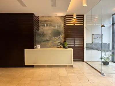 a lobby with a reception desk in a building at Black&White Angel Apartment in Kraków