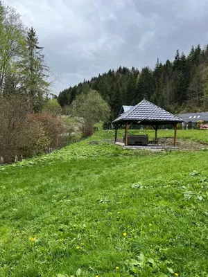 a gazebo in the middle of a field at Leśne Zacisze in Ochotnica Górna