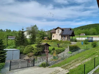 a house on a hill with a fence at Morycówka in Rzyki